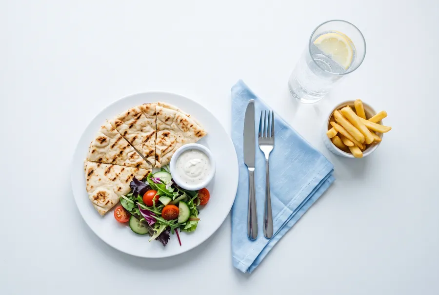 Grilled flatbread, salad, fries and sparkling water from above