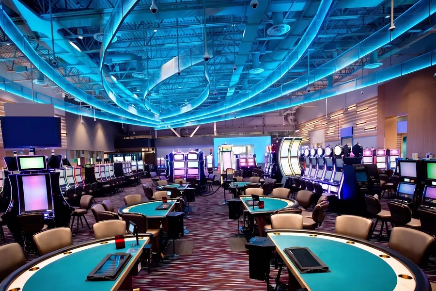 Empty blackjack tables under blue neon ribbons